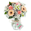 Capturing the essence of Wood Green's lively character, this bouquet is a serene combination of peach-pink roses, radiant gerberas, and crisp white chrysanthemums, artfully curated by expert florists. At its heart, the teddy-petaled roses blossom in soft spirals, nestled among bold peach and tangerine gerbera daisies with their unmistakable dark centers. Fluffy white chrysanthemums, highlighted with fresh green centers, and clouds of baby's breath bring a fullness and airy brightness to the display, reminiscent of gentle mornings in Woodside Park. Subtle sprays of eucalyptus intersperse the arrangement, adding depth and a whisper of crisp scent. The glass vase-clear, classic, and gently bulbous-proudly exhibits the flower stems and clean water inside, its neck wrapped neatly with rustic twine and a simple white tag as a finishing note. Perfect for birthdays, new beginnings, or heartfelt thank-yous, this bouquet effortlessly brings the warmth and genuine artistry of Wood Green's community florists into any home.
